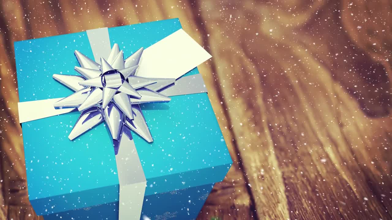 nieve cayendo con el regalo de navidad