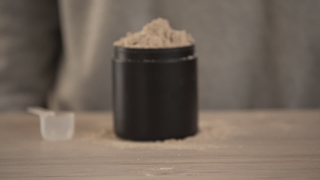 Showing whey protein powder, close up.