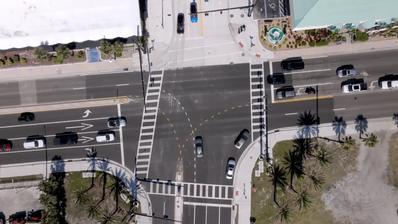 Traffic at an intersection in Daytona Beach, Florida with drone video overhead and stable.