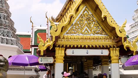 tourists explore ornate temple architecture in bangkok