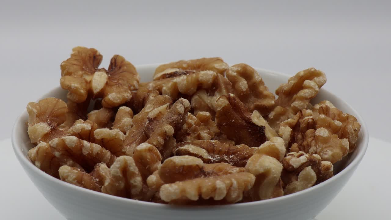 Fresh walnuts in a bowl. Video 4k