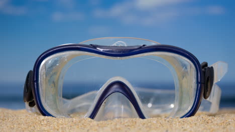 a snorkel mask on the beach