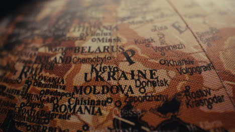 close-up of a globe highlighting ukraine and surrounding regions