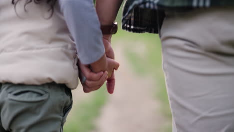 father and child holding hands