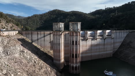 Low-water-level-dam-during-drought-season-in-Spain,-aerial-ascend-view