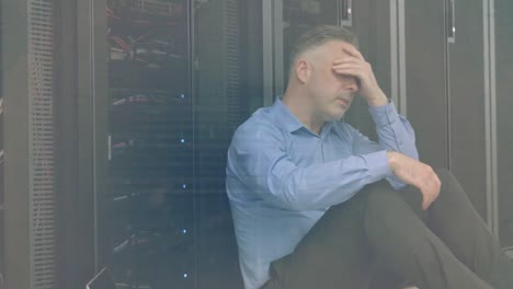 animation of data processing over tired caucasian male it technician and computer servers