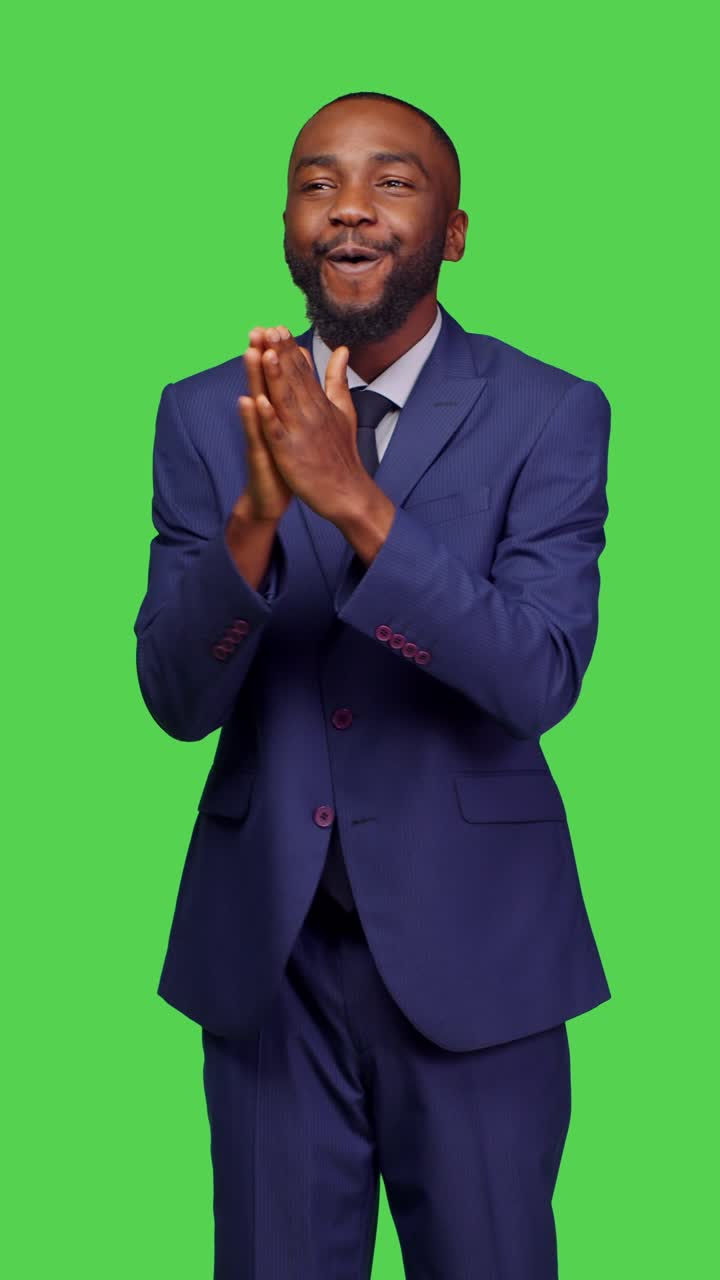 Vertical video: Front view of positive optimistic adult clapping hands and applauding