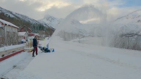 Man-struggle-removing-hard-snow-near-the-main-road-after-the-plow-blocked-the-driveway