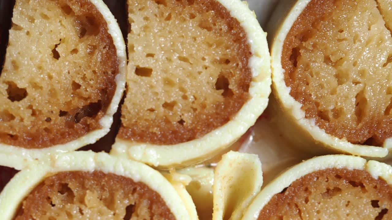 Close up of Indian rolled sweets with white coating
