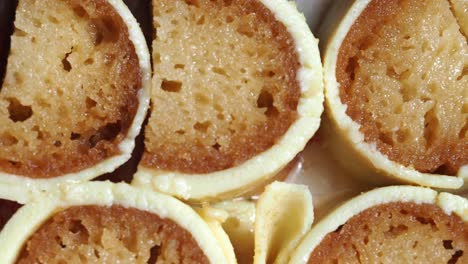 close up of indian rolled sweets with white coating
