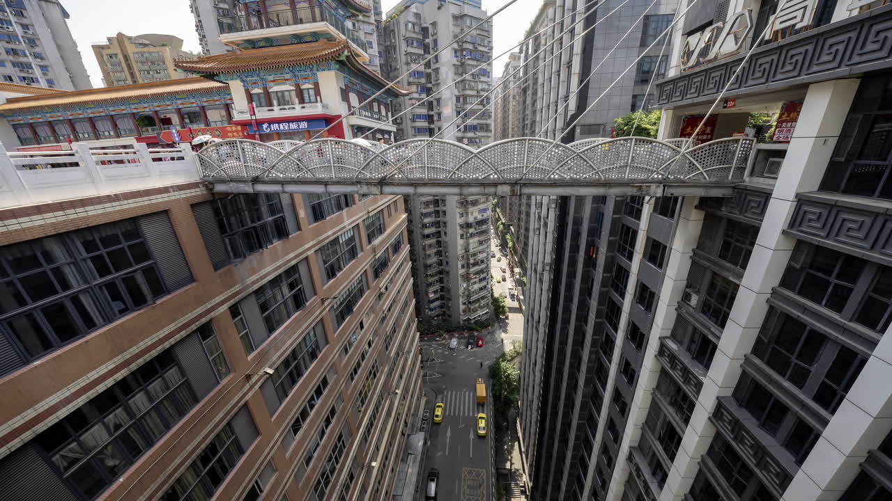 CHONGQING, CHINA - 28 MAY 2025 : Timelapse of the multi level chongqing city in china, looking down from a public square
