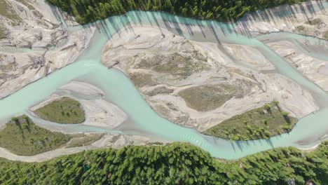 overhead view of blaeberry river with turquoise waters in the canadian rockies near golden in british columbia, canada. - aerial shot