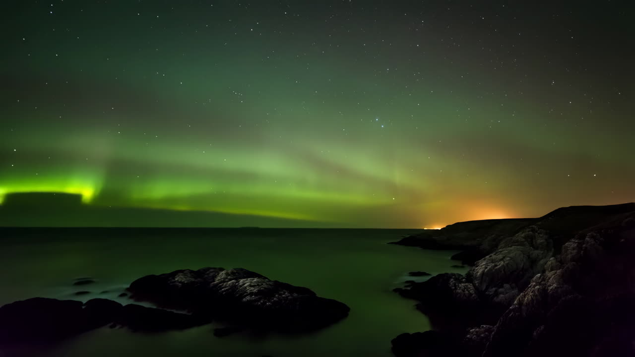 Northern Lights over the Ocean at Night