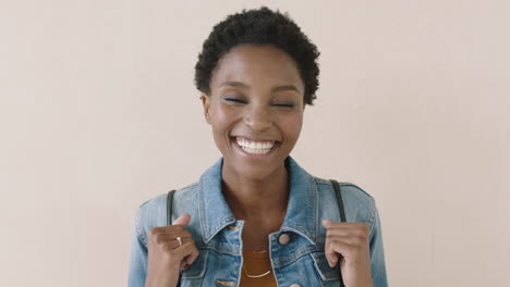 portrait of trendy african american woman laughing cheerful at camera