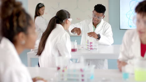 diverse students engage in a science experiment at high school in their science class