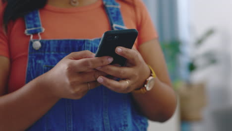 Hands,-texting-and-phone-in-home-with-black-woman