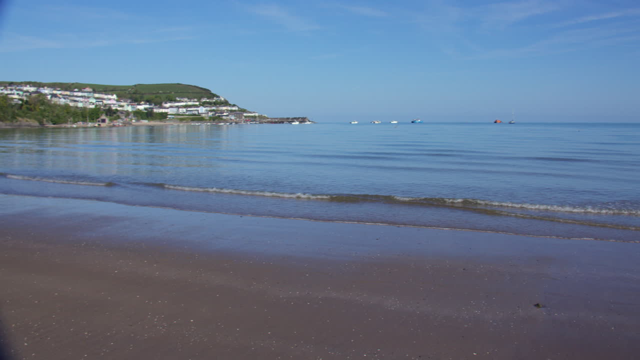 Extra wide panning shot of new quay bay taken from the beach at the waterline