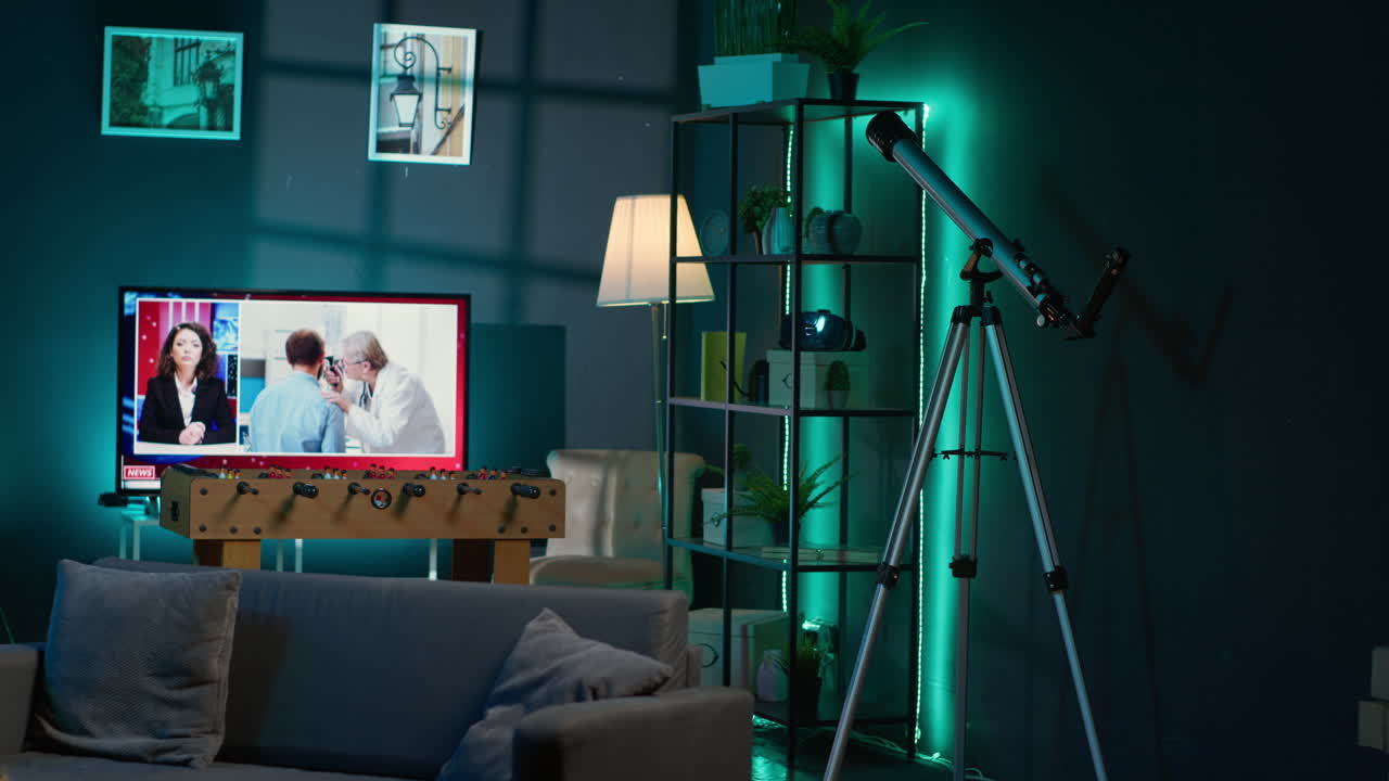 Cozy high end apartment illuminated with neon lights and a big tv, home theatre and setup for a young adult. Empty loft decorated and equipped with electronics, comfortable space.