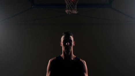 sportsman playing with basketball