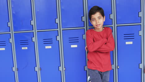 In-a-school-corridor,-a-young-Caucasian-boy-stands-confidently-with-copy-space