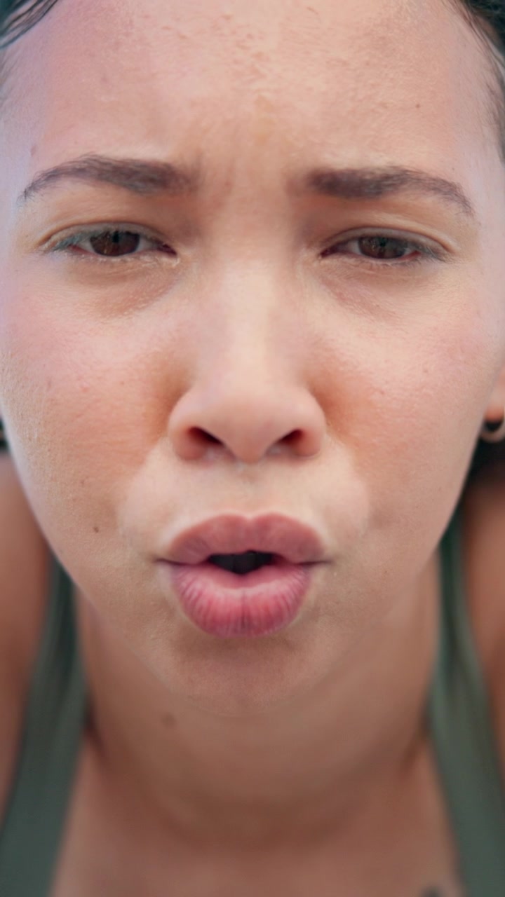Close-up of Sweaty Woman Breathing Heavily After Intense Workout