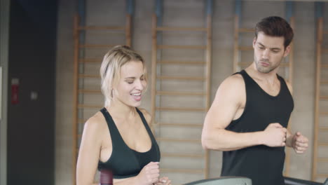 Pretty-woman-getting-results-on-treadmill.-Athletic-lady-making-yes-gesture.