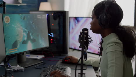 African-streamer-playing-on-powerful-RGB-computer-shooter-video-game-losing