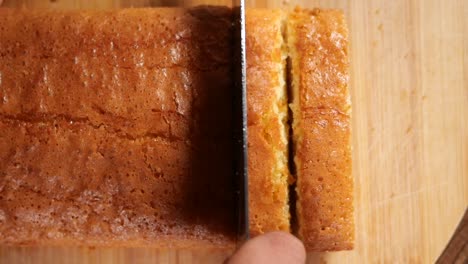cutting a loaf cake