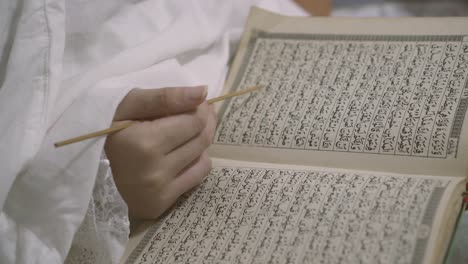 Asian Muslim Woman Reading Al-Quran