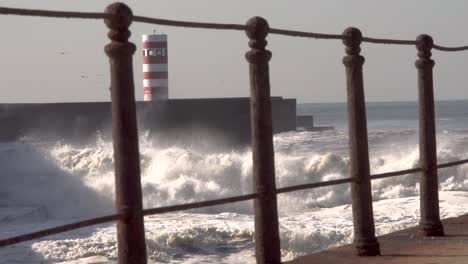 ocean-big-waves-crash-over-the-lighthouse-frame-the-frame