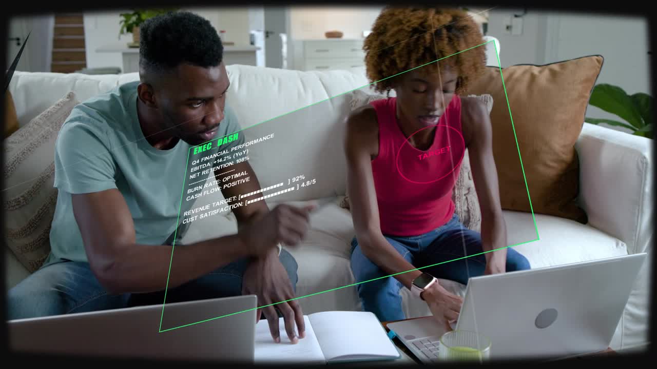 Woman showing printed page and initiating HUD overlay, couple collaborating on finance with laptops