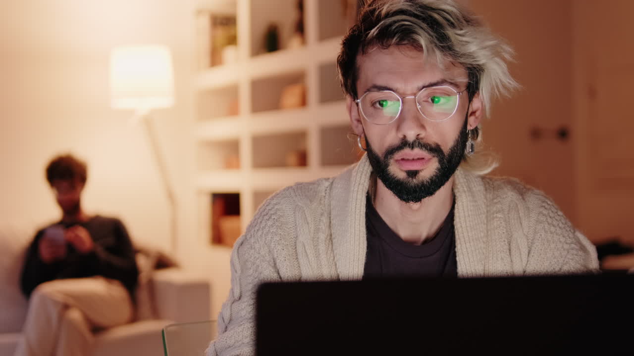 Gay Couple Working From Home at Night