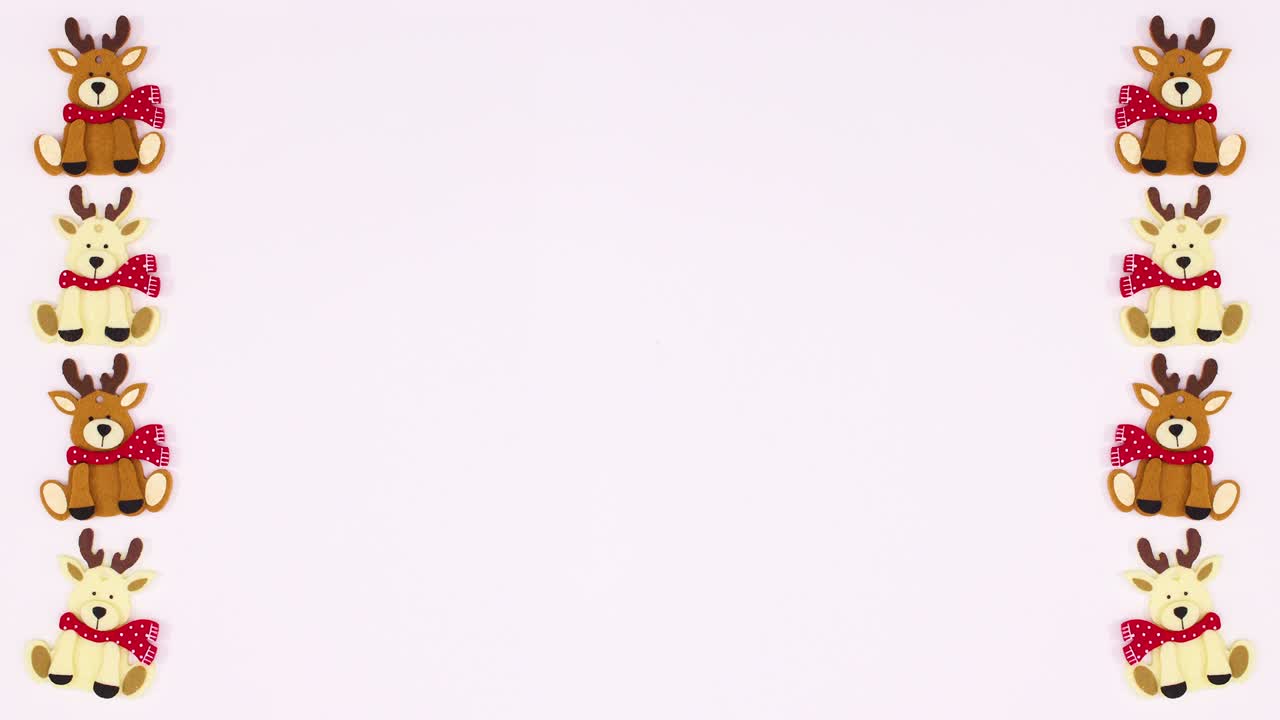 los renos de navidad se mueven en el lado izquierdo y derecho del tema blanco.