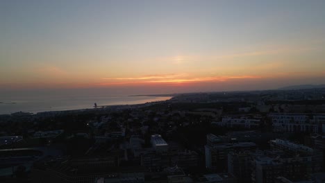 aerial drone shot during sunset of the marina in lisbon, portugal