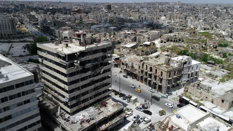 beautiful rooftop of buildings of aleppo under the sunlight. view above the buildings in ruins of the syrian city - aerial view with a drone 4k