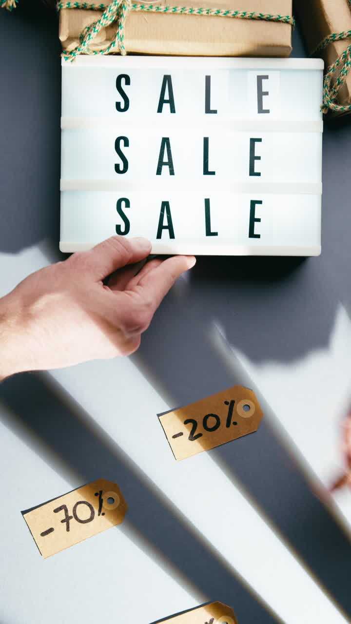 Sale text flowing over freebies and discount percentages overhead shot