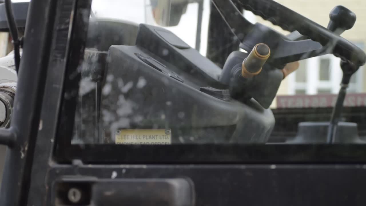 Industrial plant machinery driver cab tilting shot