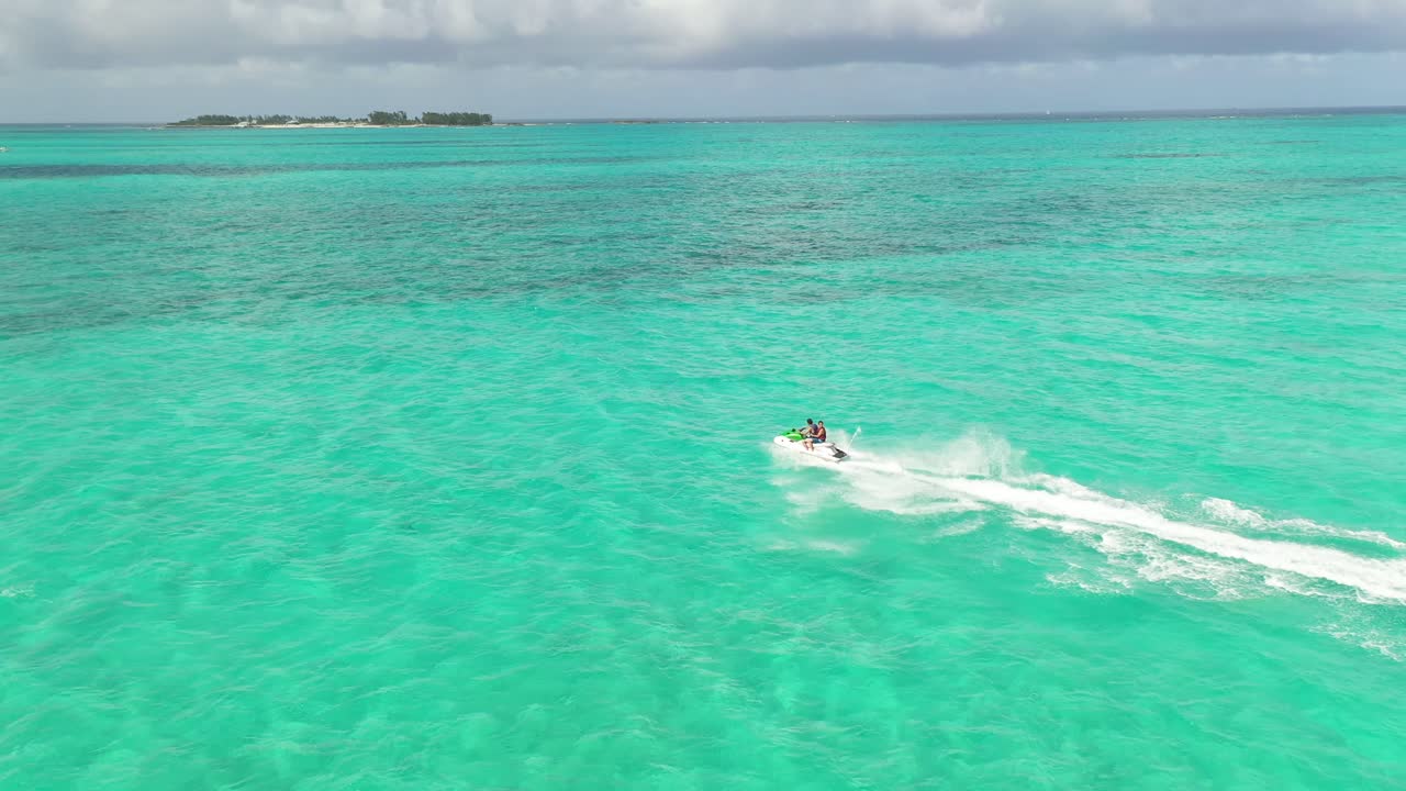 Jet Ski Watercraft in Turquoise Tropical Sea, Bahamas, Nassau, Drone Aerial View
