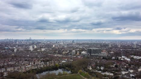 wide panoramic aerial shot panning left over london cityscape on overcast cloudy day
