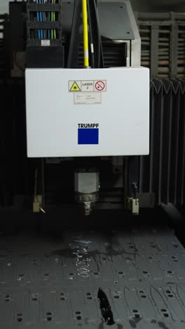 vertical shot of cnc machine electronic equipment and laser device, czechia