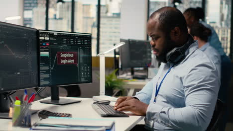trader in office spots suspicious login attempt warning on trading platform