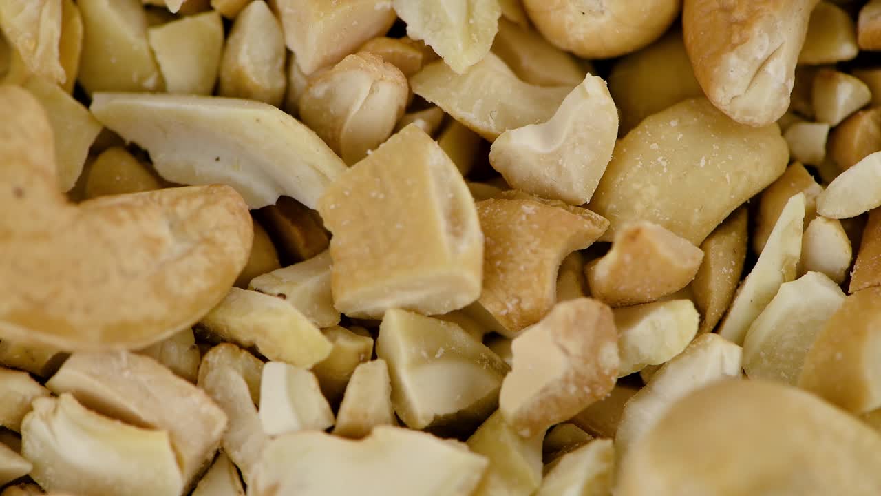 Portion of chopped Cashew Nuts on a rotating plate (seamless loopable)