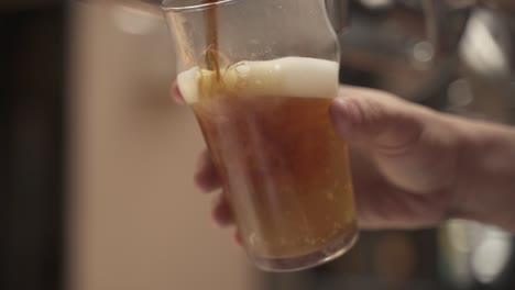 Slow-motion-shot-of-Bartender-pouring-raft-beer-in-bar,close-up-shot