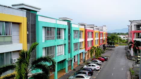 aerial flight down a street with very colourful accents