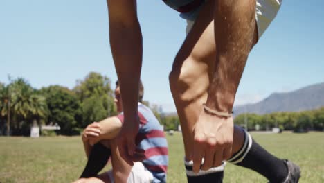 rugby players tying the shoe lace on the field 4k 4k