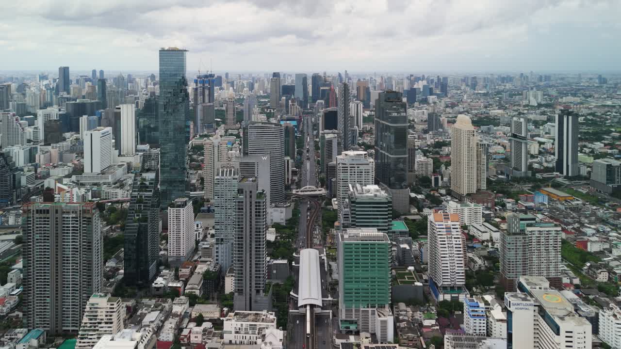 Aerial Drone View of Bangkok City Skyline with Modern Skyscrapers, Urban Growth, and Expanding Metropolitan Landscape
