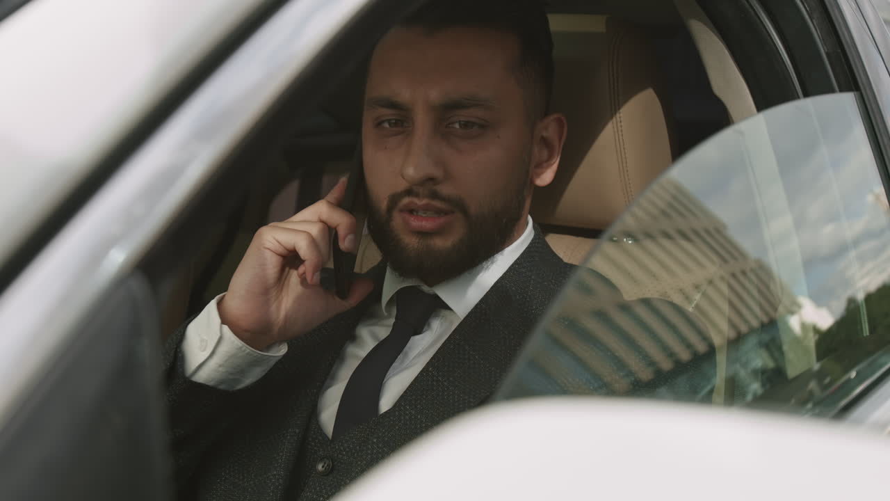 Talking on Phone and Lowering Car Window