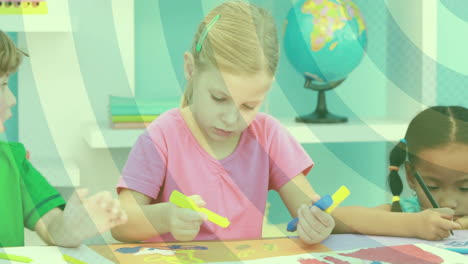 children coloring at table with swirling green animation over classroom background