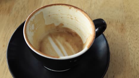 Top-view-of-empty-coffee-cup-on-table