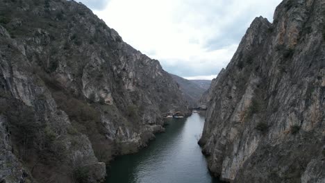 aerial shot of treska river running through matka canyon, natural beauty at the junction of the mountains